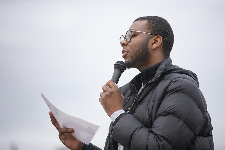 A person speaks into a microphone.